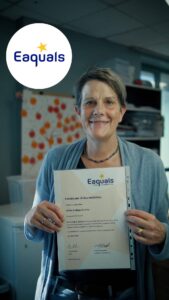 Eaquals Certificate of Accreditation for SEDA College Dublin, reconfirmed until 30 June 2030, held up in an office with the Eaquals logo in the corner