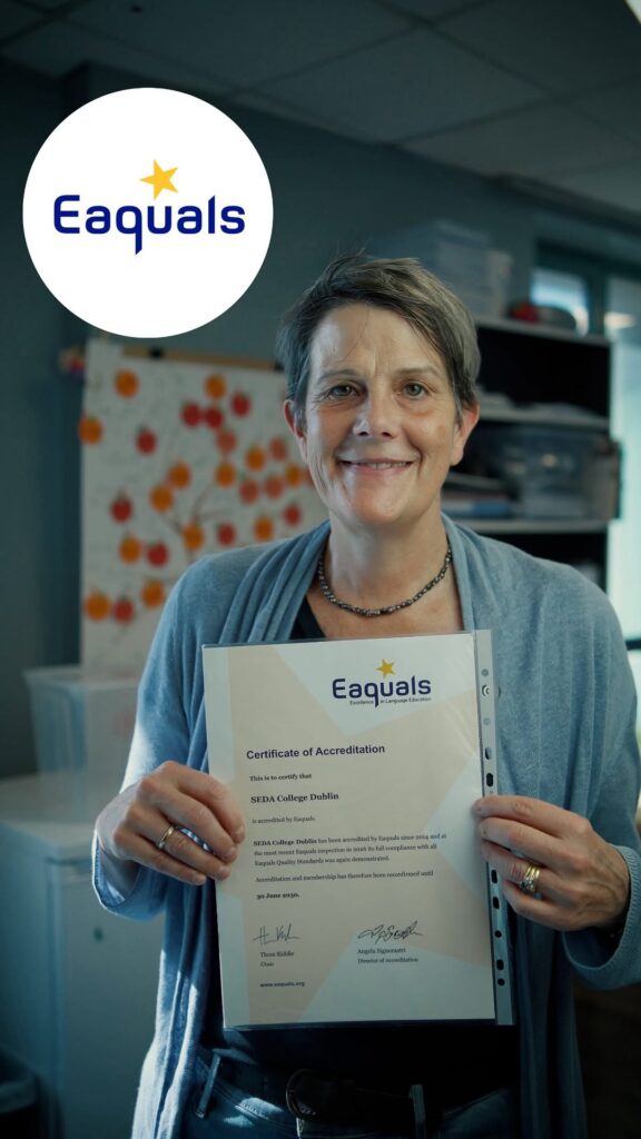 Eaquals Certificate of Accreditation for SEDA College Dublin, reconfirmed until 30 June 2030, held up in an office with the Eaquals logo in the corner